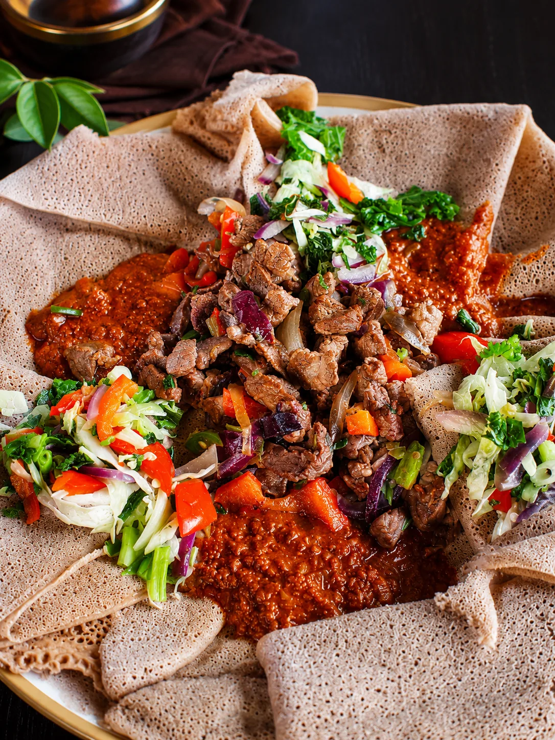 An Ethiopian platter with beef tibs, vegetables and injera