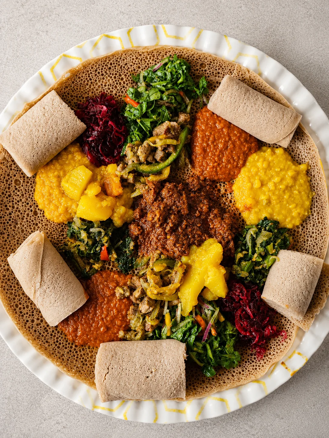 An Ethiopian combination platter with vegetables, legumes and injera